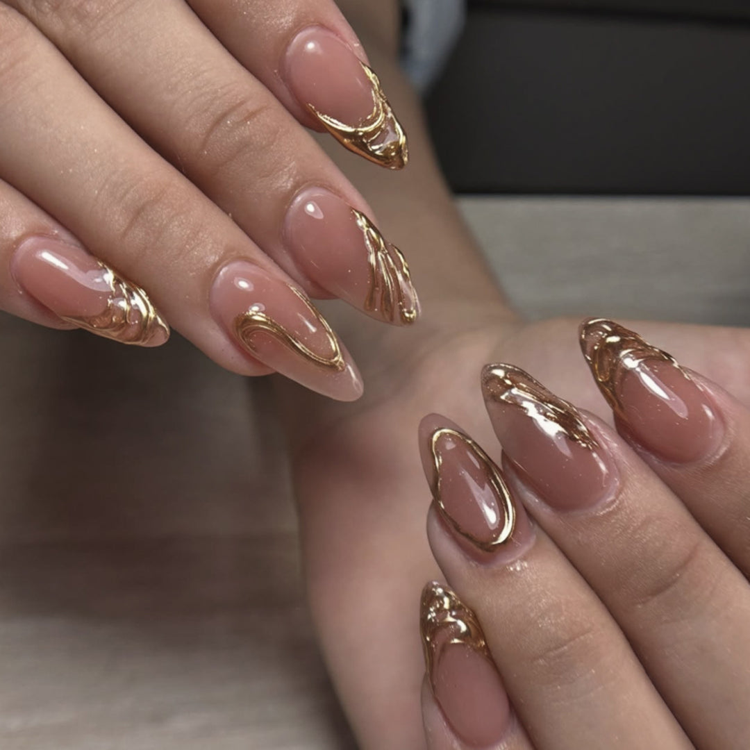 Artistic acrylic nails with gold embellishments Bowlift