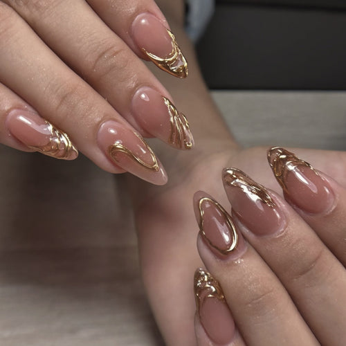 Artistic acrylic nails with gold embellishments Bowlift