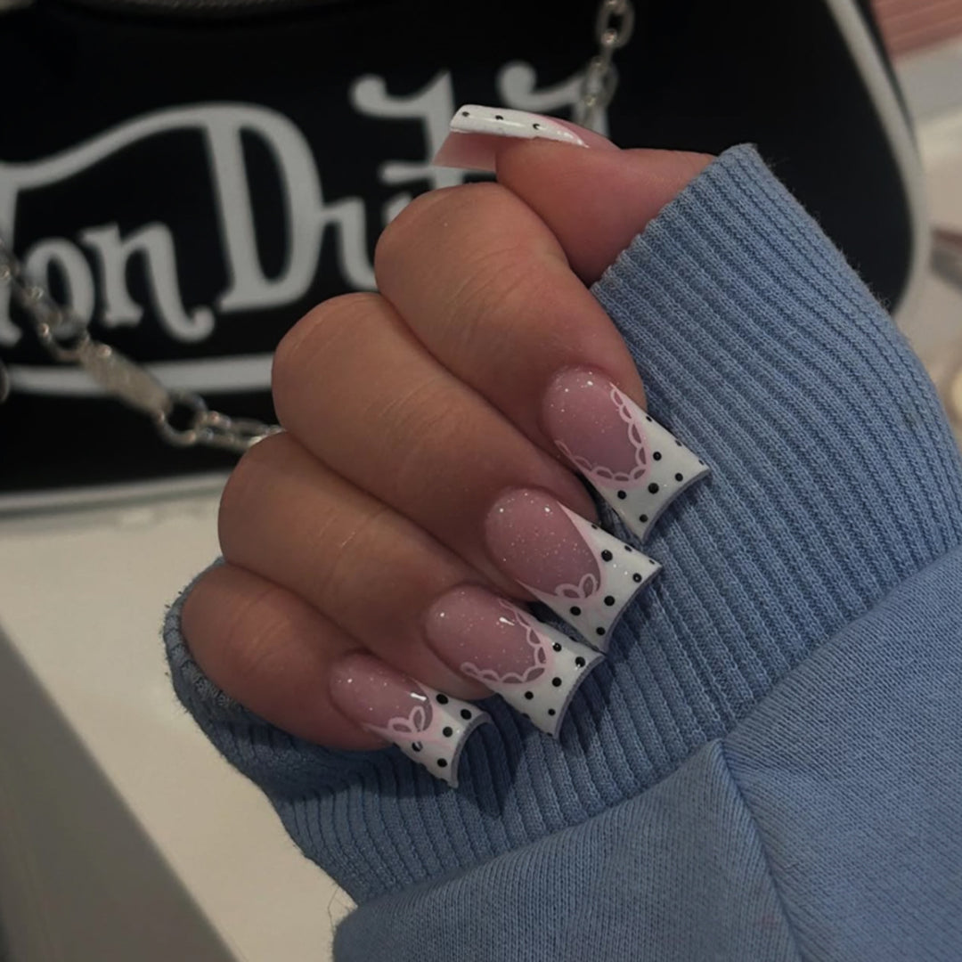 Artful Nail Art with Flower Design and Blue French Tip Bowlift