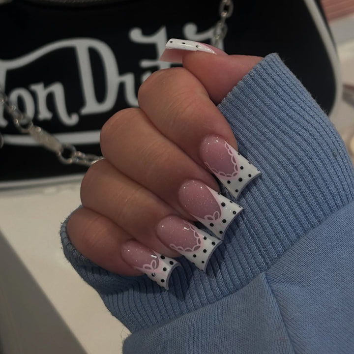 Artful Nail Art with Flower Design and Blue French Tip Bowlift