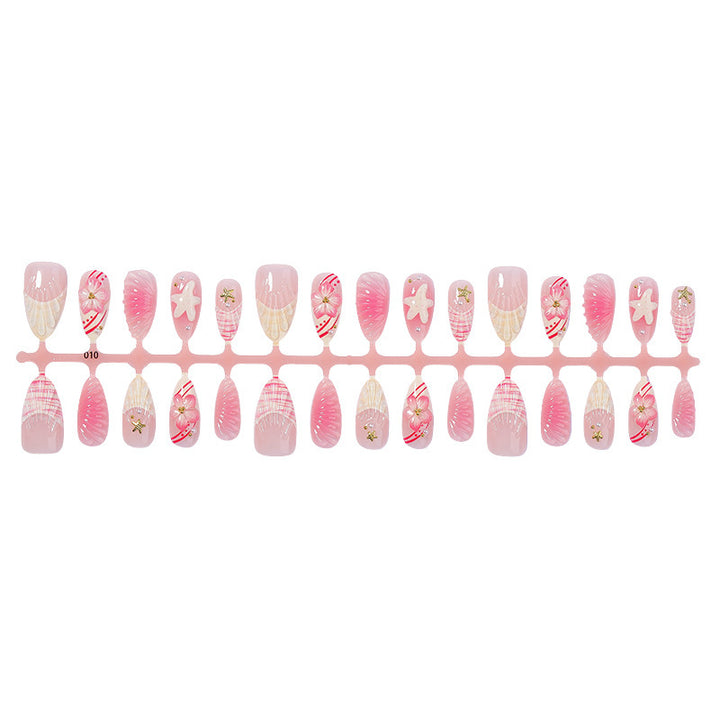 Artificial nail set with maritime motifs and glamorous accents Bowlift