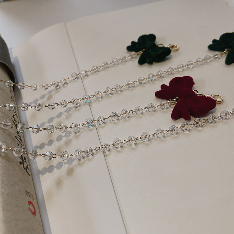Jewelry holder chain with velvet bow pendant Bowlift