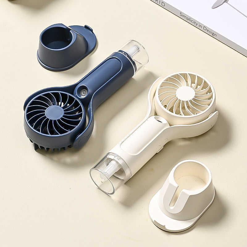 Unisex portable handheld fan with tiltable head, foldable stand and USB charging station Bowlift