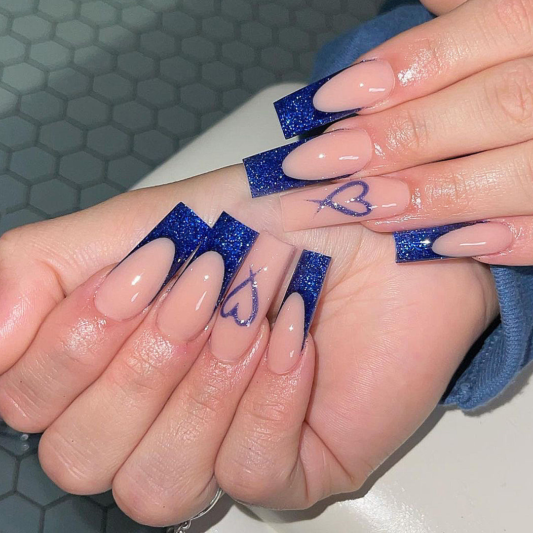 Artificial nails with glitter accents and unique heart design Bowlift