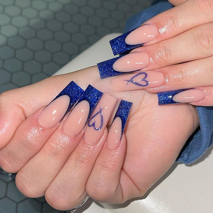 Artificial nails with glitter accents and unique heart design Bowlift