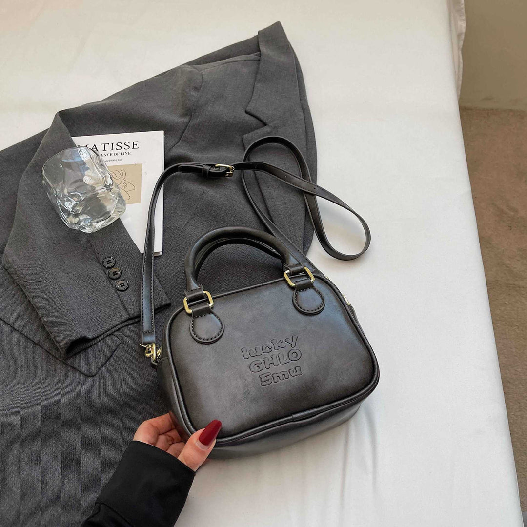 Vintage-Inspired Structured Handbag Bowlift