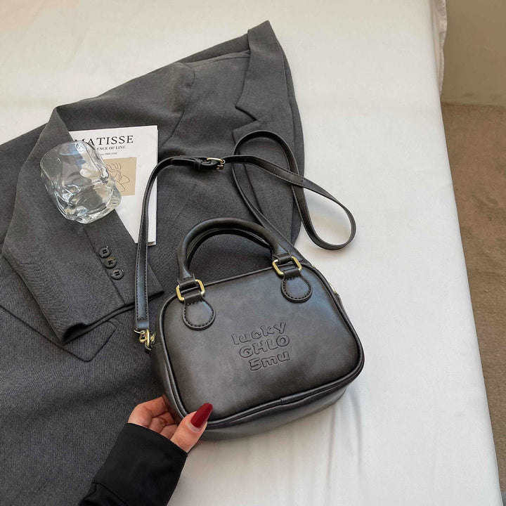 Vintage-Inspired Structured Handbag Bowlift