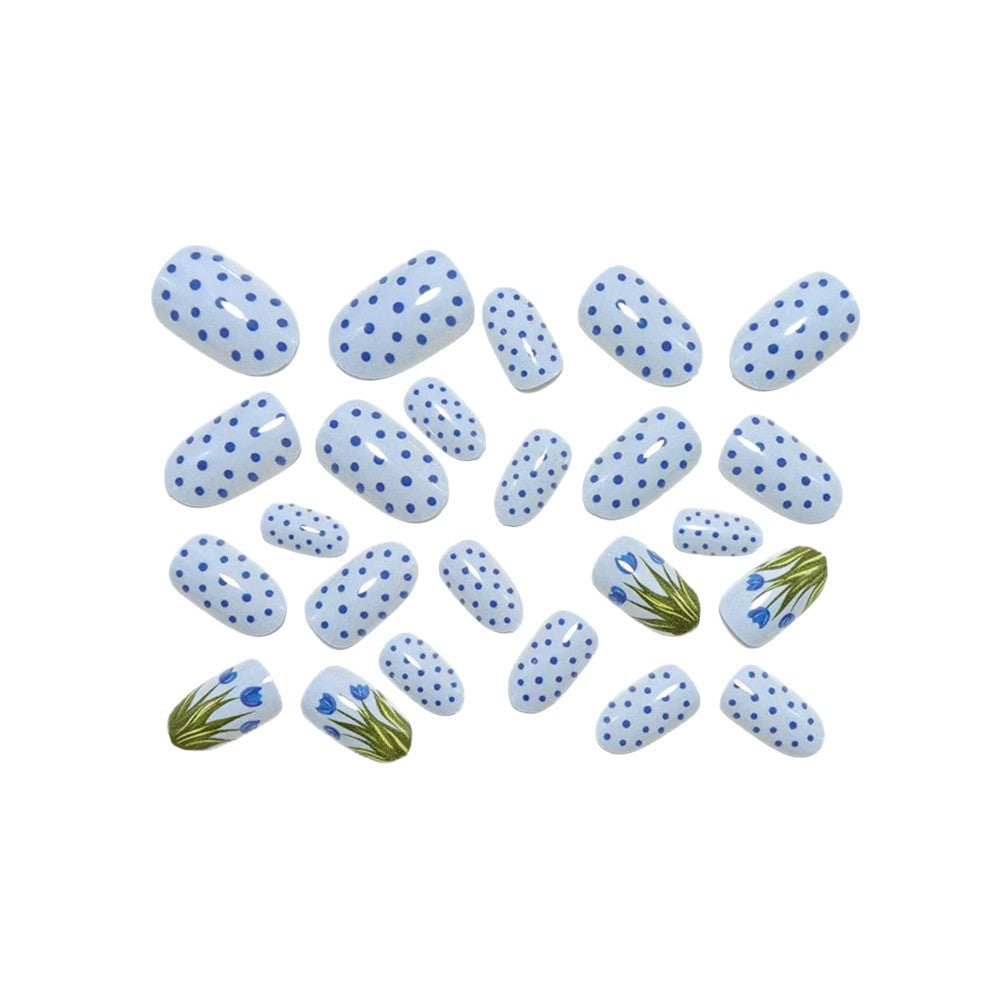 Creative art nails in an elegant polka dot design with floral accents Bowlift