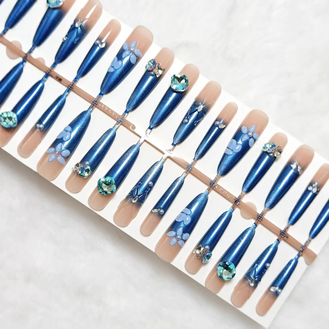 Elegant artificial nails with floral applications and glitter elements Bowlift