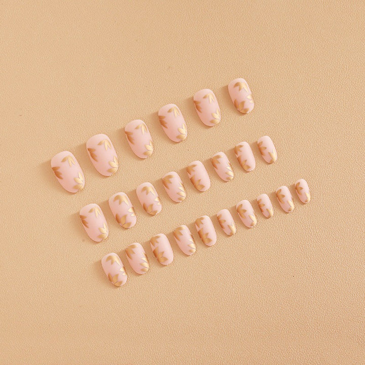 Artificial nail set with elegant gold leaf design Bowlift