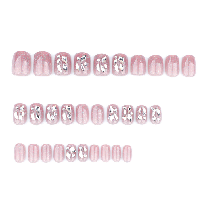 Artificial nail art with glamorous glitter accents Bowlift