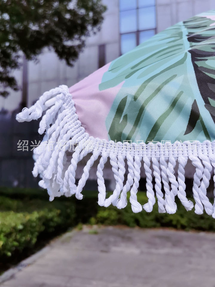 Ladies sun umbrella with tropical leaf design and tassel decoration Bowlift