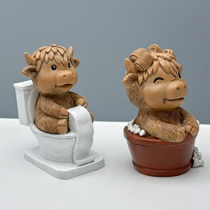 Funny decorative figure of a Highland cow on toilet Bowlift
