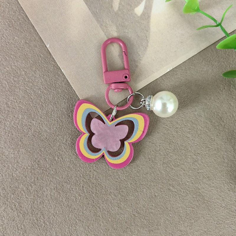 Keychain with butterfly and pearl accent Bowlift