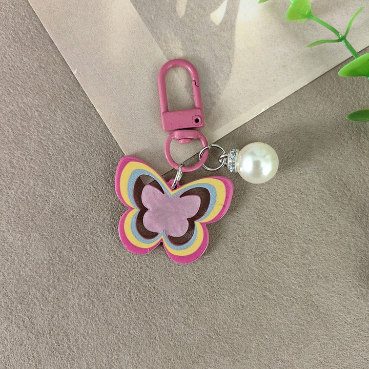 Keychain with butterfly and pearl accent Bowlift