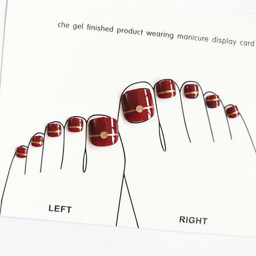 Artificial toenails with elegant gold embellishments Bowlift