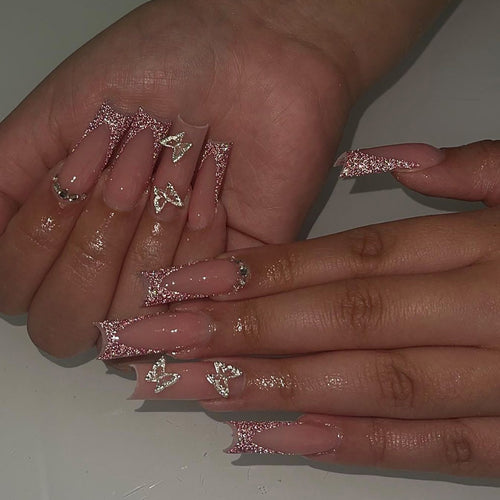 Artful Nail Extensions with Glitter and Decorative Accents Bowlift