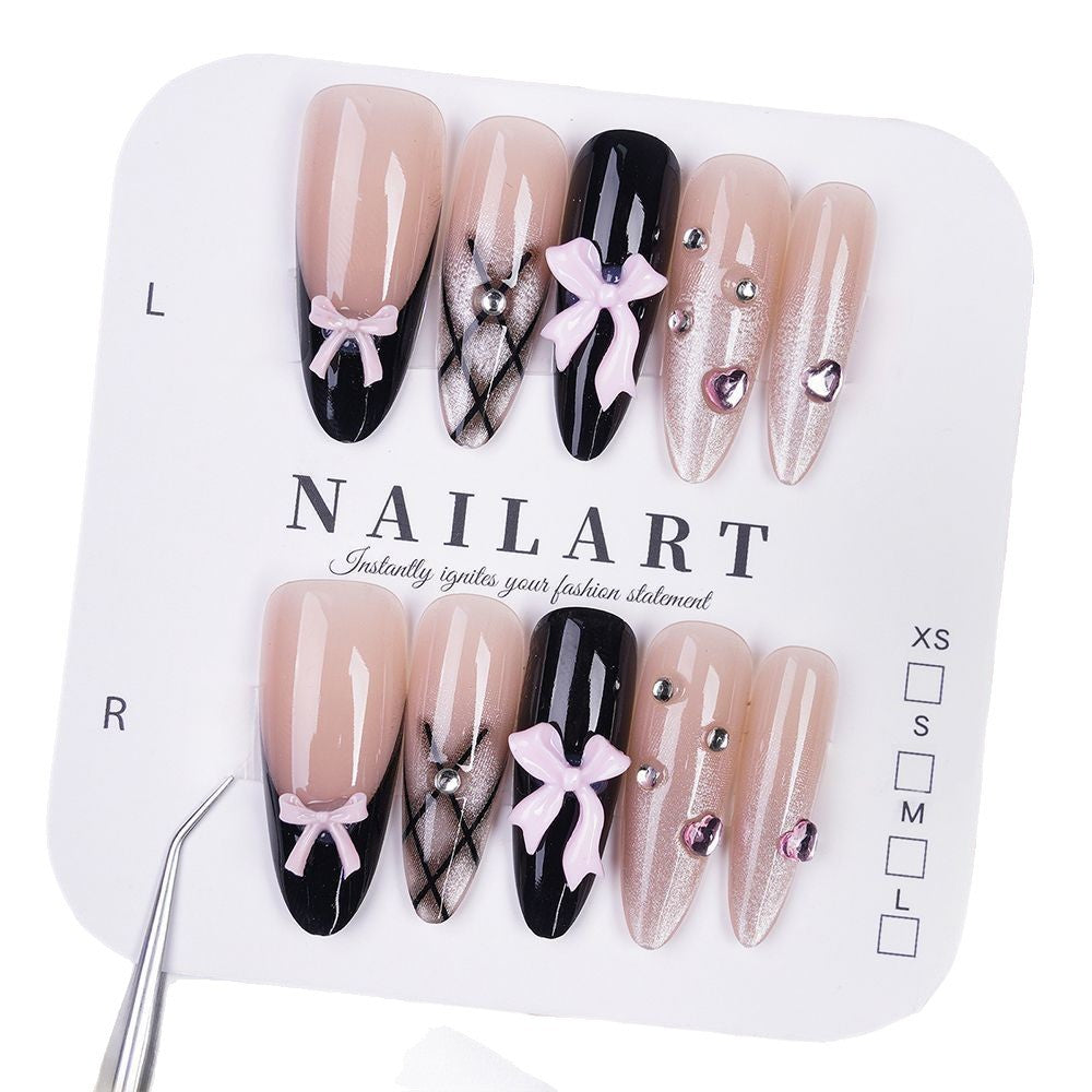 Artificial nails with playful bow design and glitter effects Bowlift