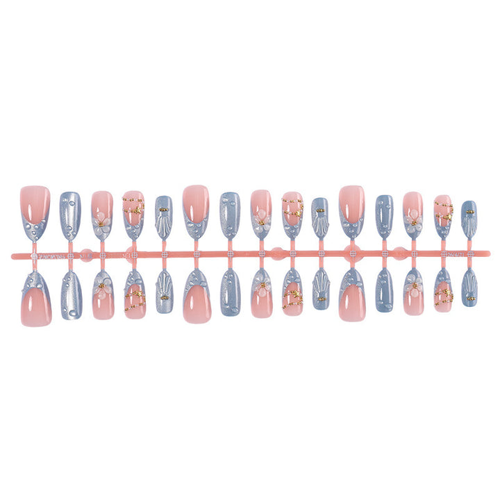 Creative acrylic nail set with elegant flower and glitter accents Bowlift