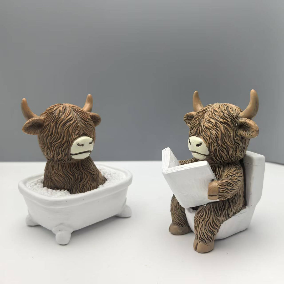Funny decorative figure of a Highland cow in a bathtub Bowlift