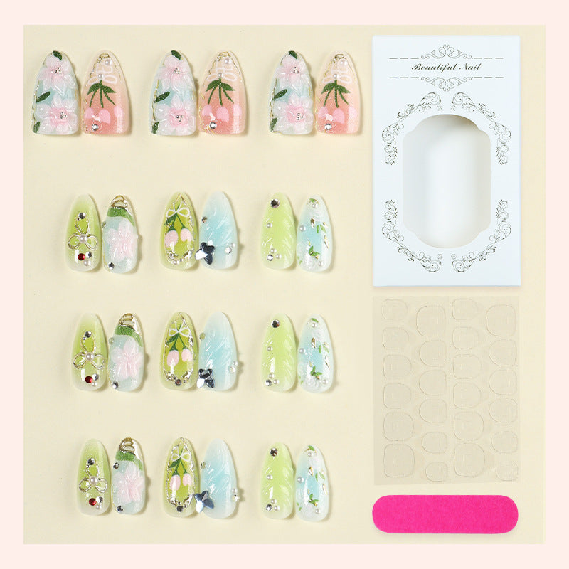 Acrylic nail set with handcrafted floral designs and glitter accents Bowlift