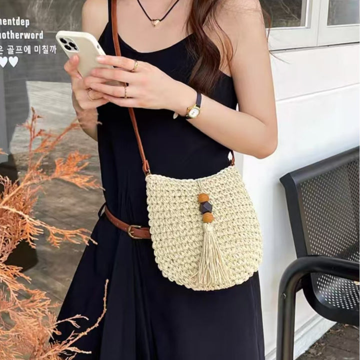 Handwoven shoulder bag with tassels and wooden details Bowlift