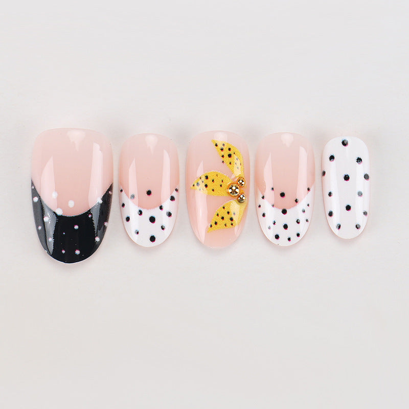 Artistic Press-On Nails with Floral and Polka Dot Designs Bowlift