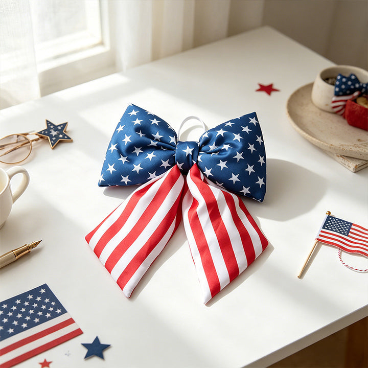 Women with large bow hair clip featuring patriotic star stripe motif Bowlift