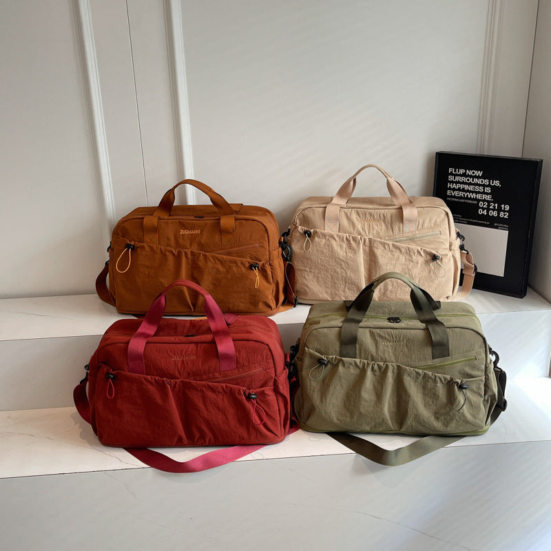 Sporty and Functional Travel Bag with Multiple Outer Pockets Bowlift