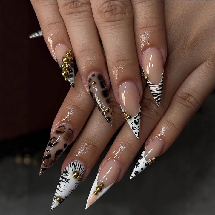 Stiletto fake nails with animal pattern and gold accents Bowlift