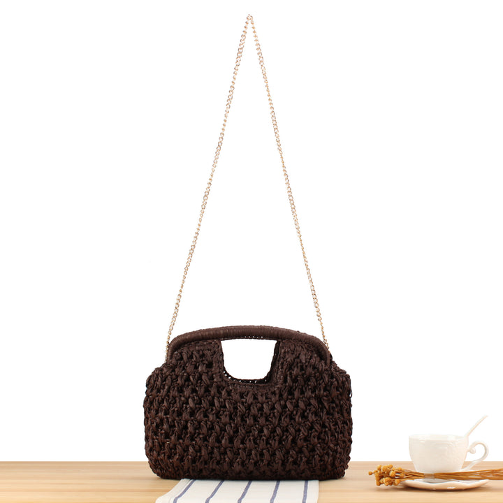 Handbag made of naturally untreated woven material with elegant chain embellishment Bowlift