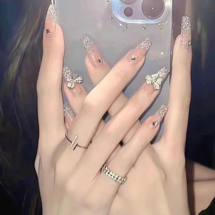 Glamorous artificial nails with heart and glitter details Bowlift