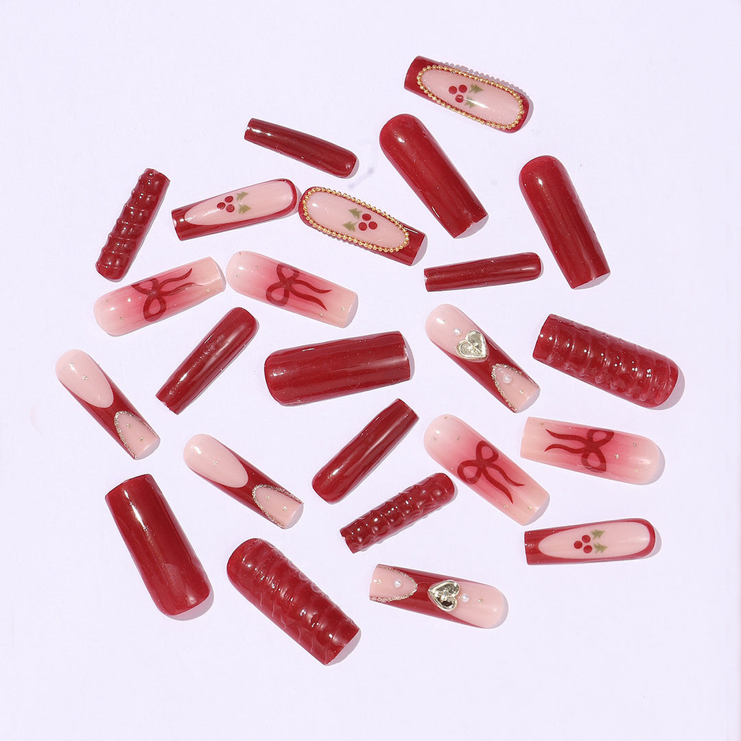 Artificial nail set with festive accents and glitter embellishments Bowlift