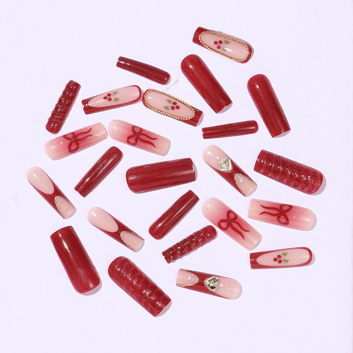 Artificial nail set with festive accents and glitter embellishments Bowlift