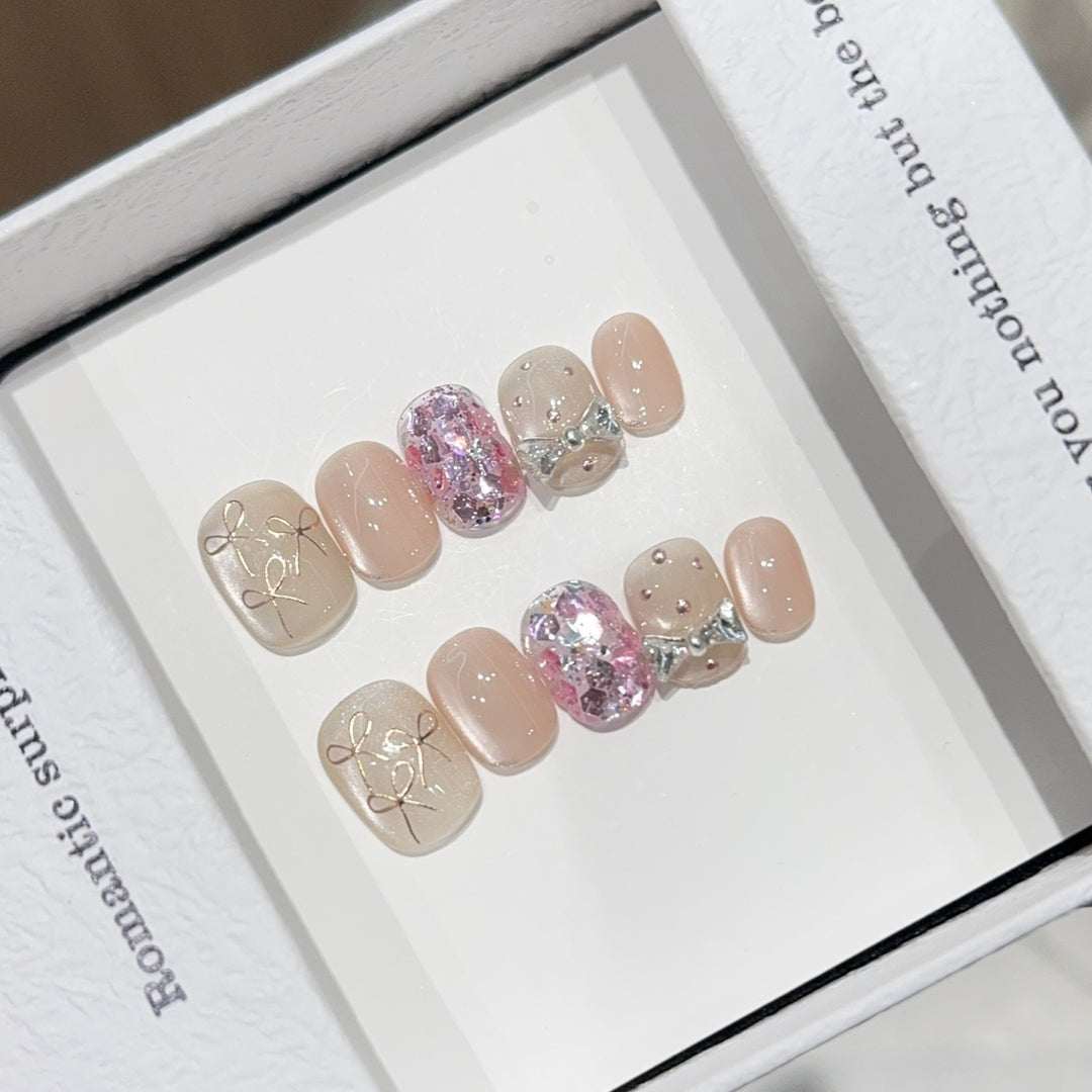 Artificial nails with romantic bow design Bowlift