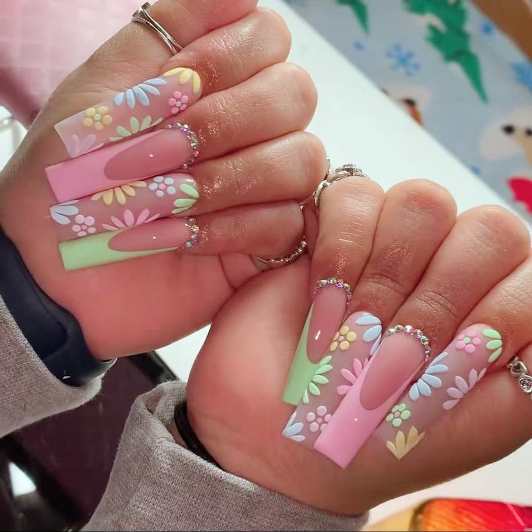 Artificial nail set with floral 3D embellishments and rhinestone accents Bowlift