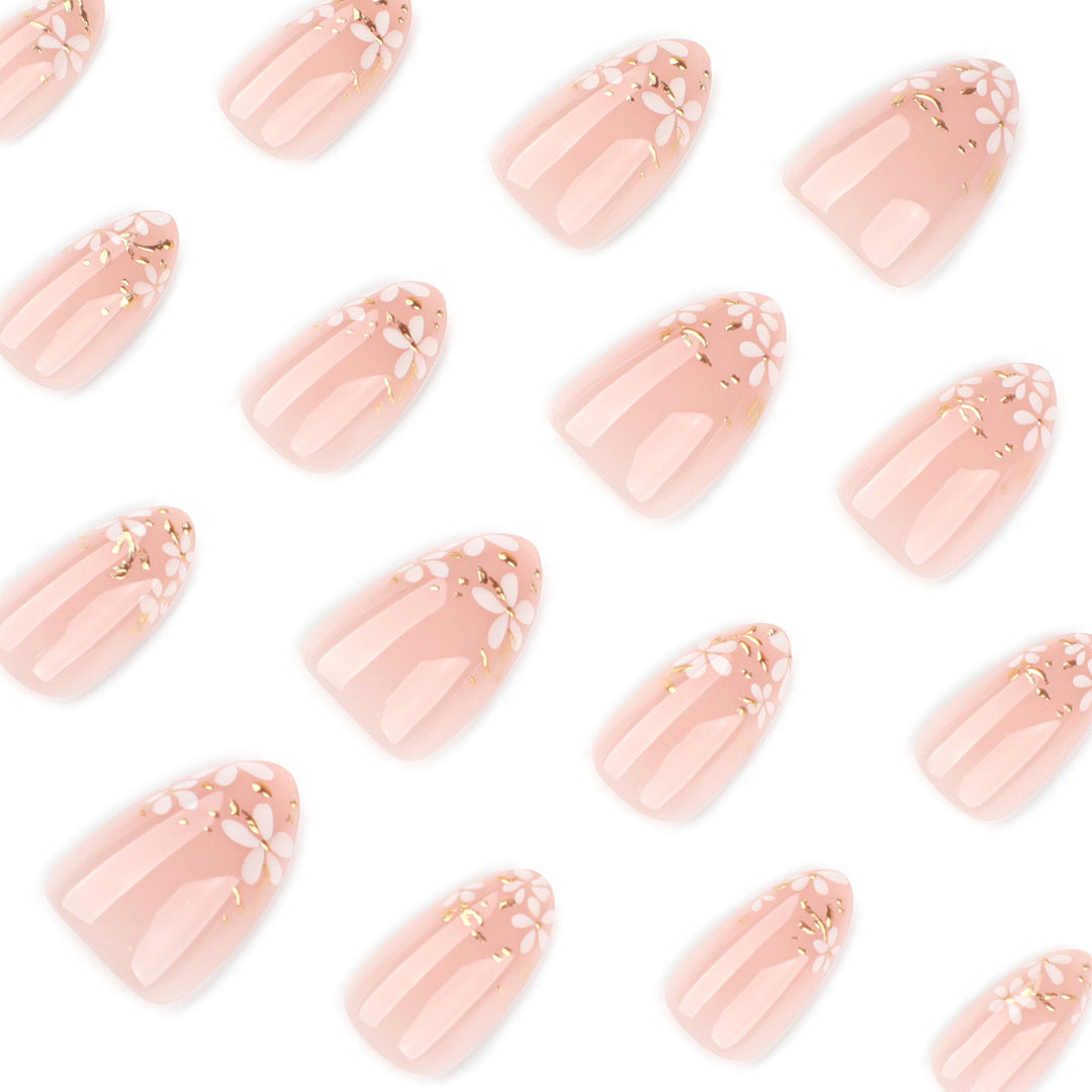 Artful nail art with floral design and glitter accents Bowlift