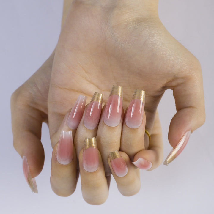 Shiny artificial nails with elegant gold rim Bowlift