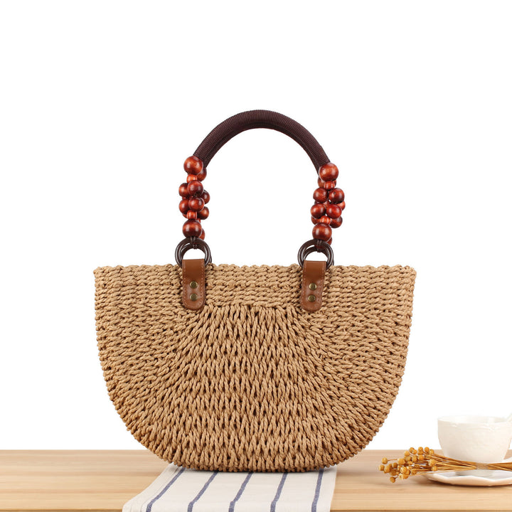 Basket bag with elegant wooden handles and textured surface Bowlift