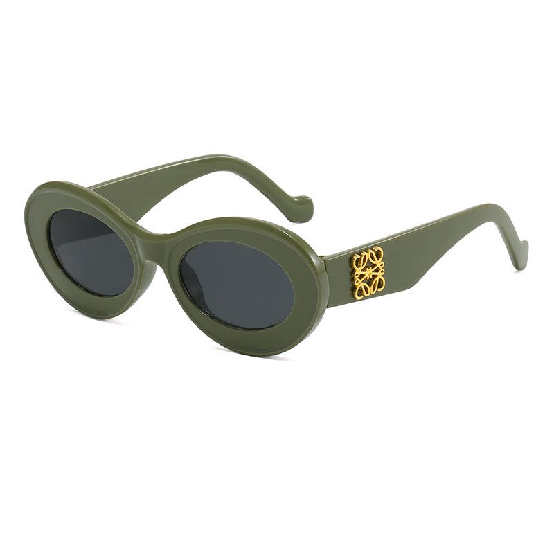 Women's fashionable sunglasses with oval frame and golden applications Bowlift
