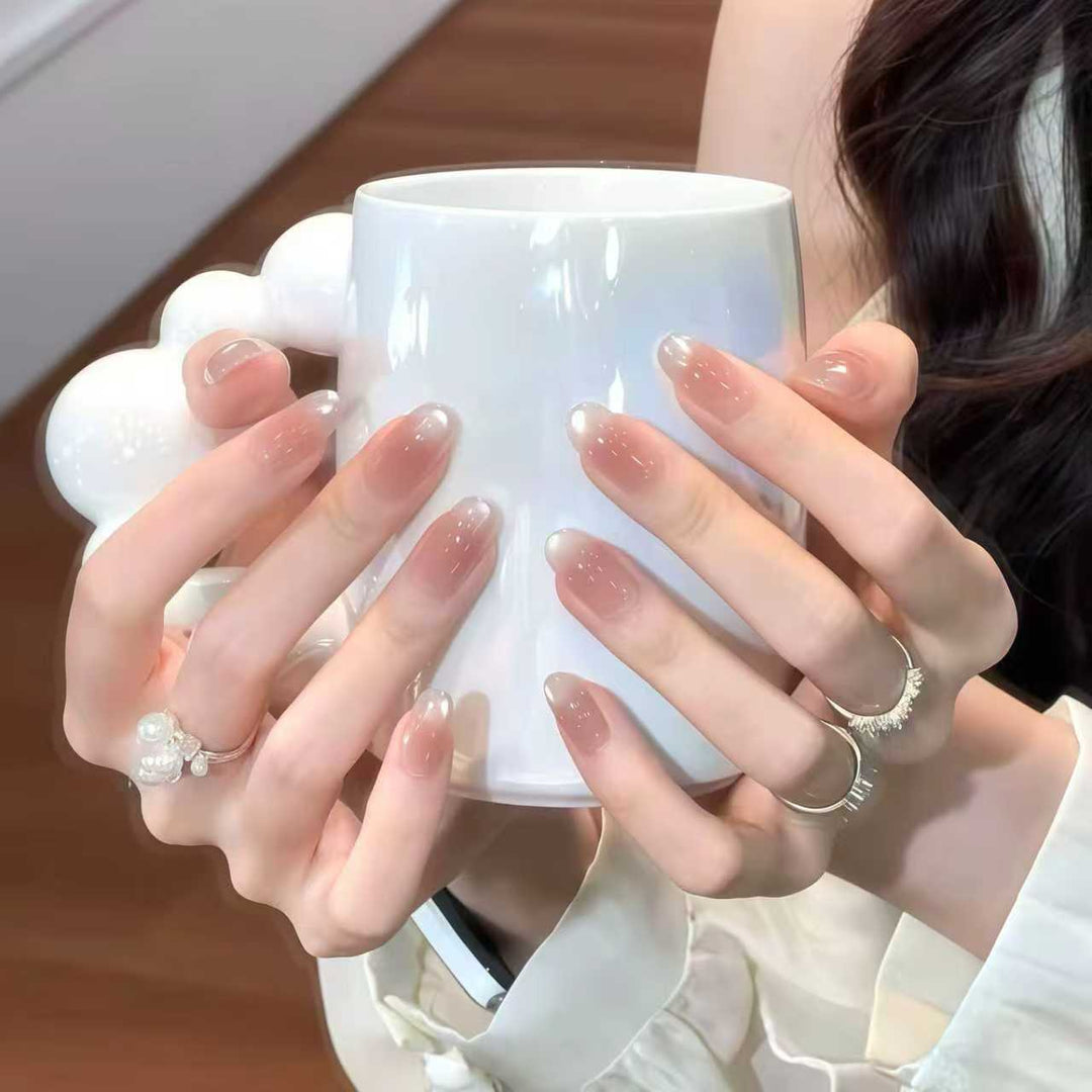 Artificial nails with elegant ombre effect and glitter coating Bowlift