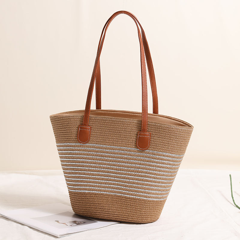 Elegant bast handbag with leather accents Bowlift