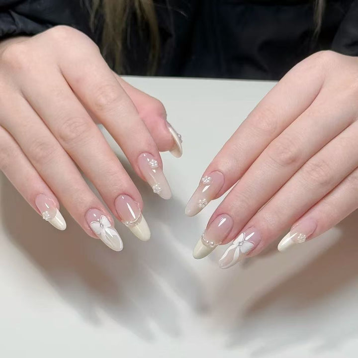 Artistic Press-On Nail Set with Floral and Glossy Accents Bowlift