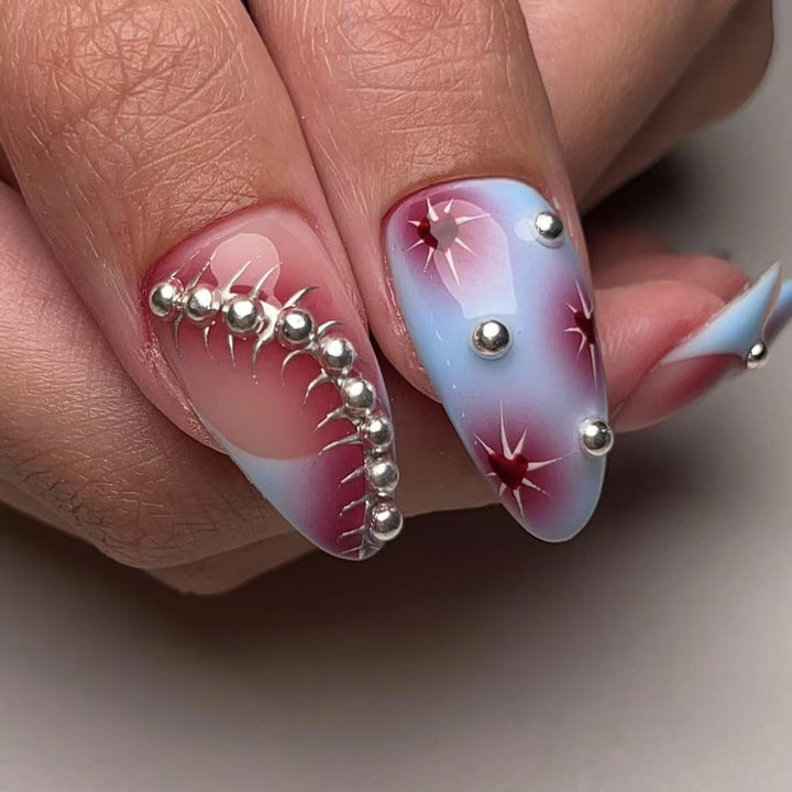 Creative nail art set with artistic color gradients and glitter embellishments Bowlift