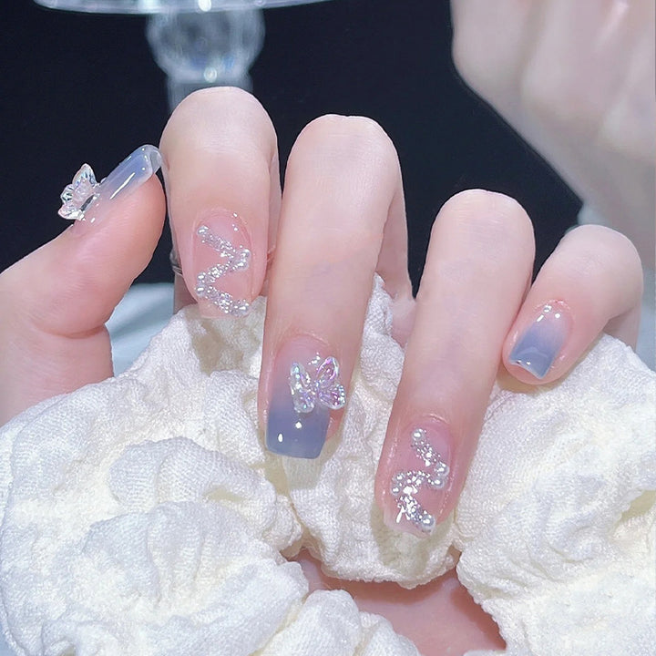 Acrylic nail set with sparkling glitter elements and appealing ombre design Bowlift
