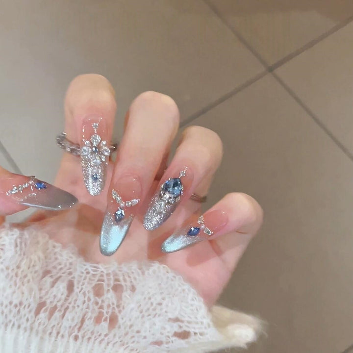 Glamorous artificial nails with sparkling rhinestone accents Bowlift