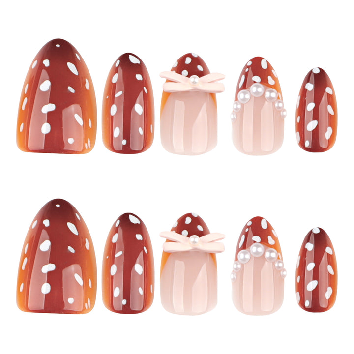 Artificial nail art with dot pattern and bow accents Bowlift