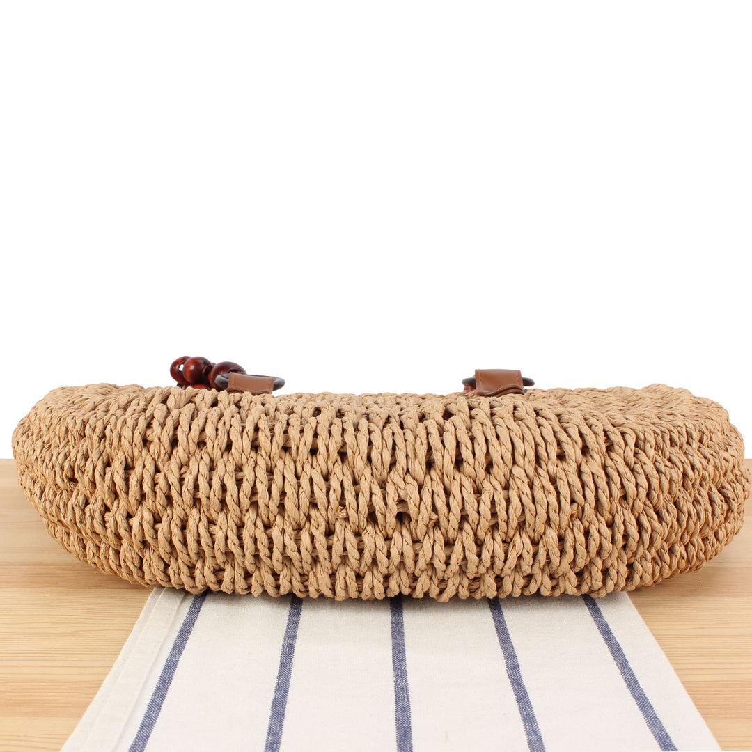 Basket bag with elegant wooden handles and textured surface Bowlift