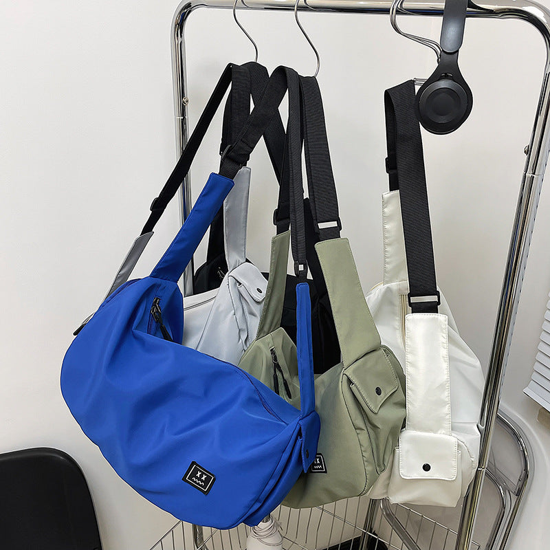 Sporty shoulder bag with adjustable carrying strap Bowlift