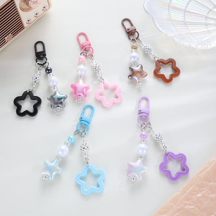 Playful keychain with floral and star motif Bowlift